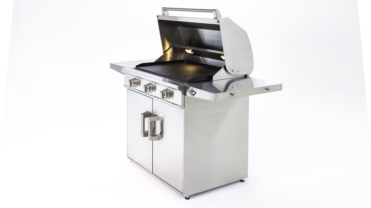 Induction Hardware 36-inch outdoor built-in induction griddle with the hood open, showing the removable carbon-steel cooking surface