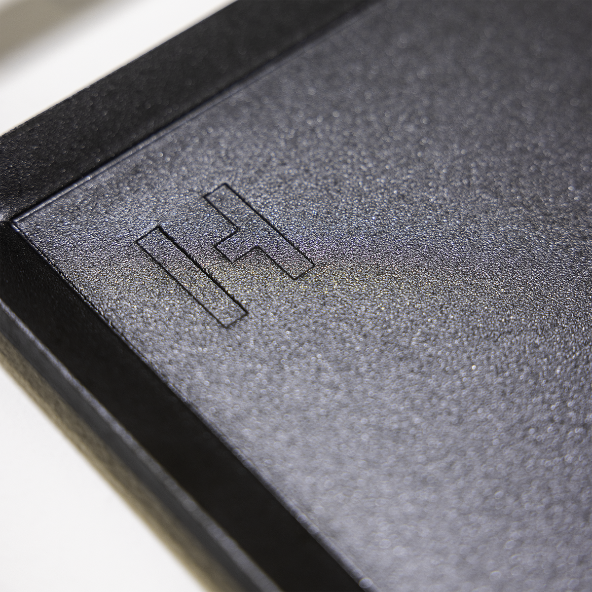 Carbon Steel Griddle Plate angled view showing matte-black carbon steel surface